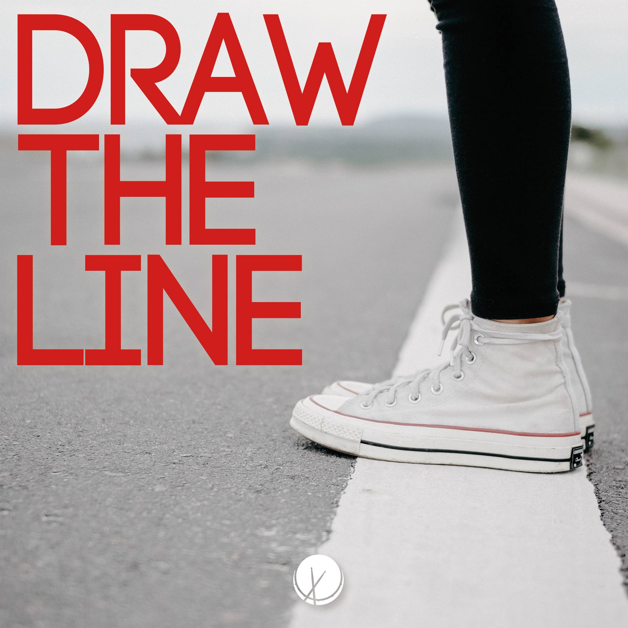 Draw the Line: Daytime, close-up image of girl's legs and sneakers, standing on a white line in asphalt.