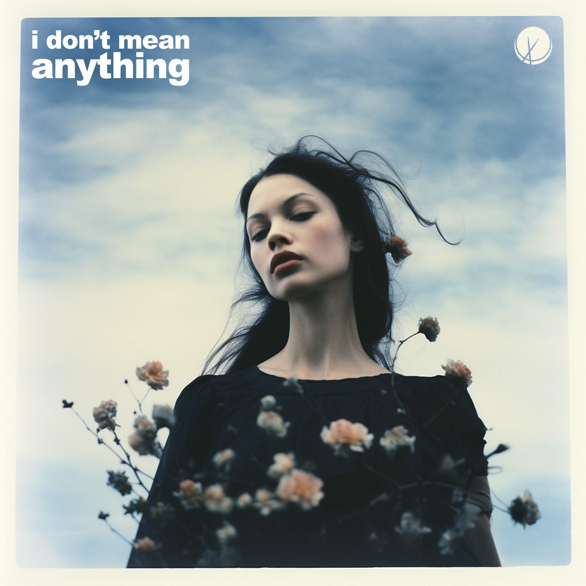 A poignant polaroid image featuring a black-haired woman in a black dress, surrounded by flowers, against a backdrop of a serene blue sky with scattered clouds.