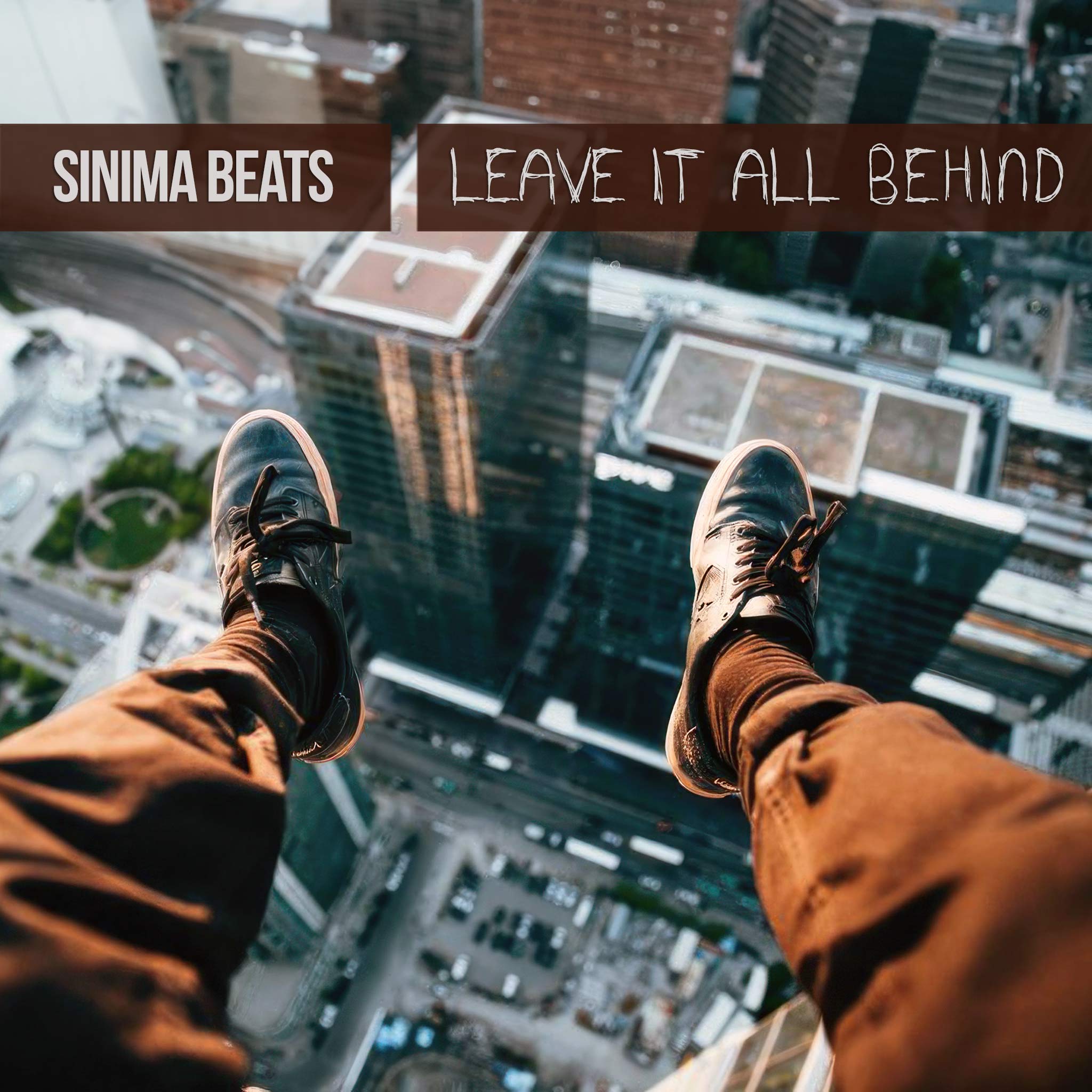 Aerial Photograph of Man's Feet in Brown Pants and Black Sneakers Viewed from Above the City - Leave It All Behind