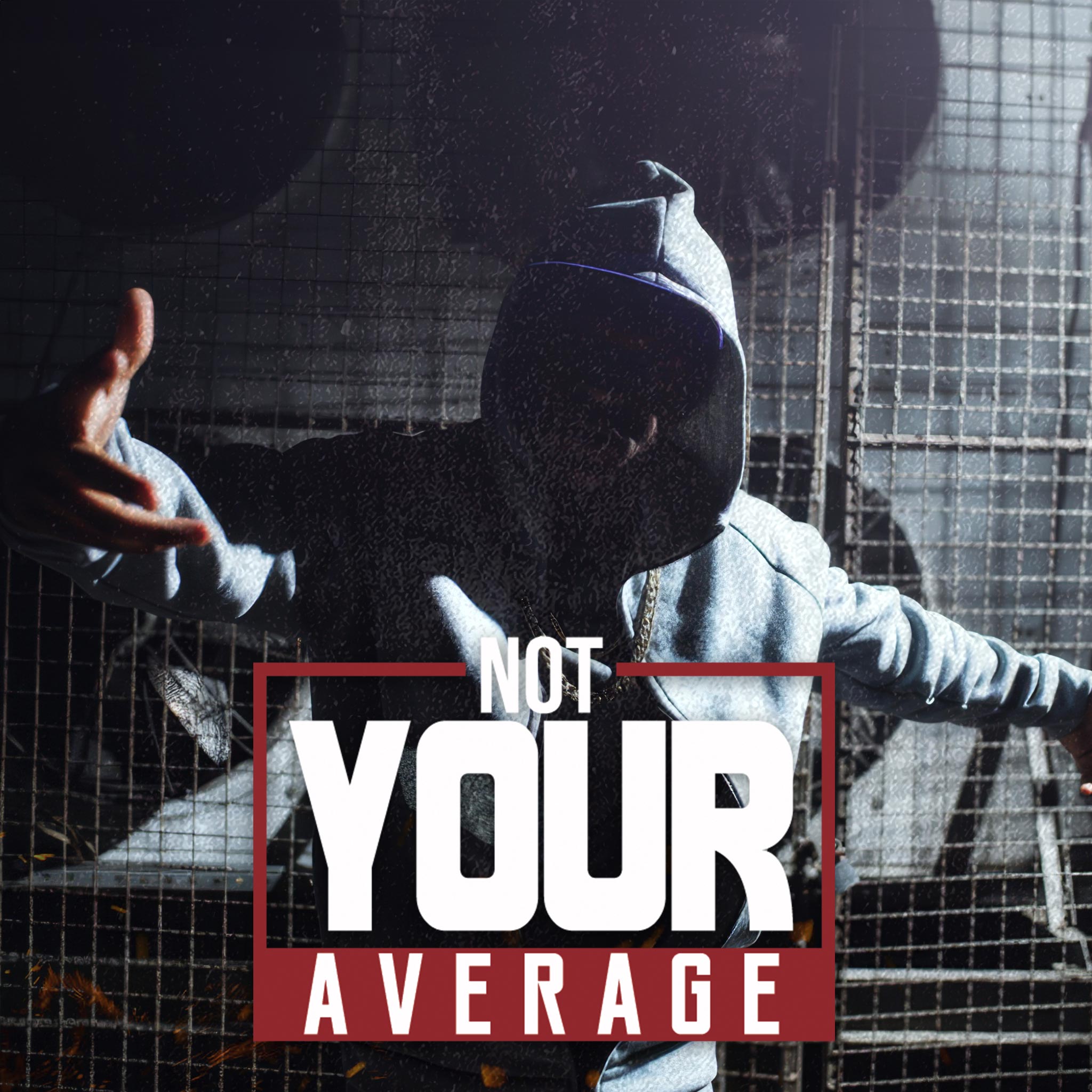 A rapper, not your average performer, in a gray hooded sweatjacket strikes an action-packed performance pose in an urban setting, embodying the energy and attitude of the streets. Title: 'Not Your Average Rapper.'