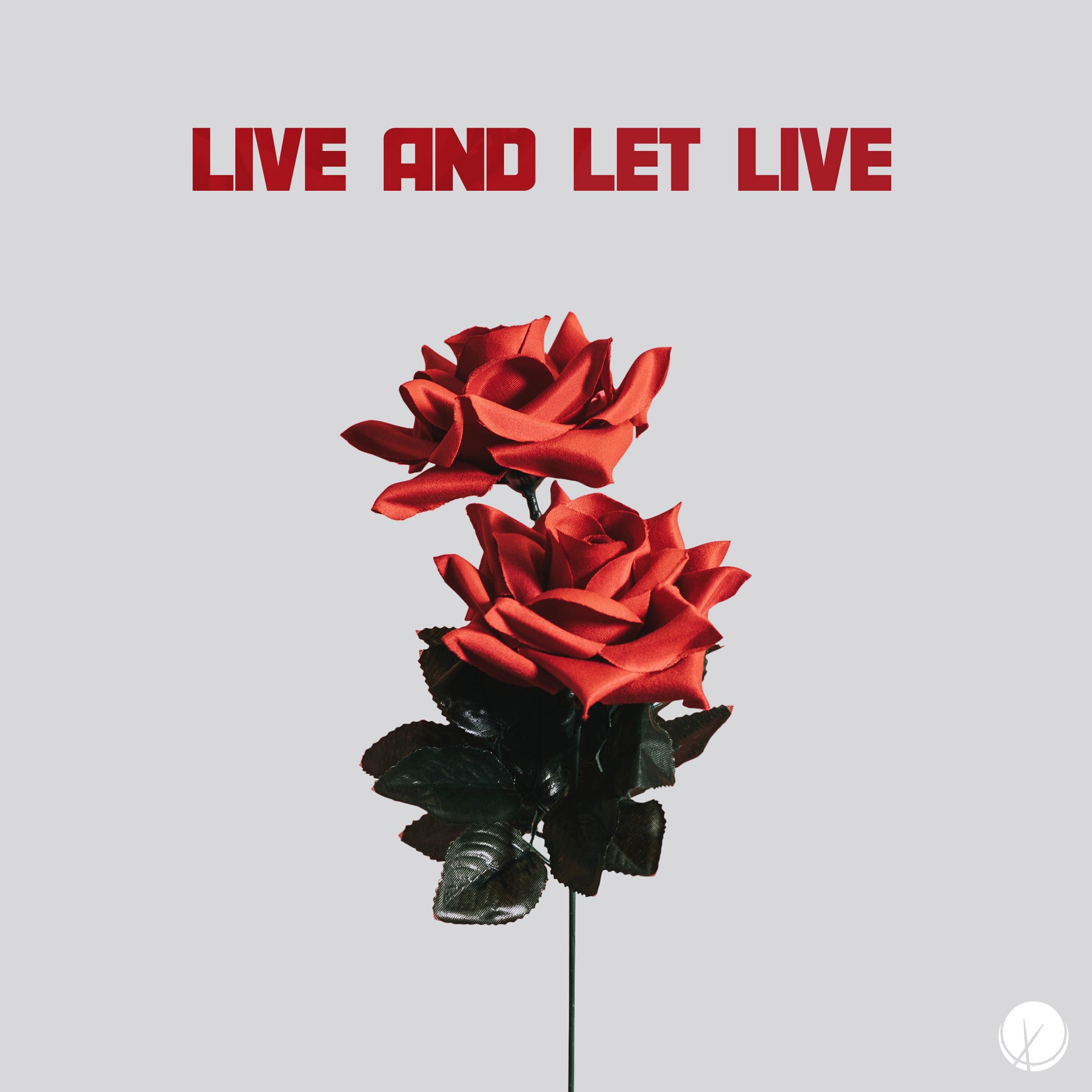 Cover art for ambient piano music titled "Live and Let Live." Features stemmed artificial roses centered over a solid gray background.