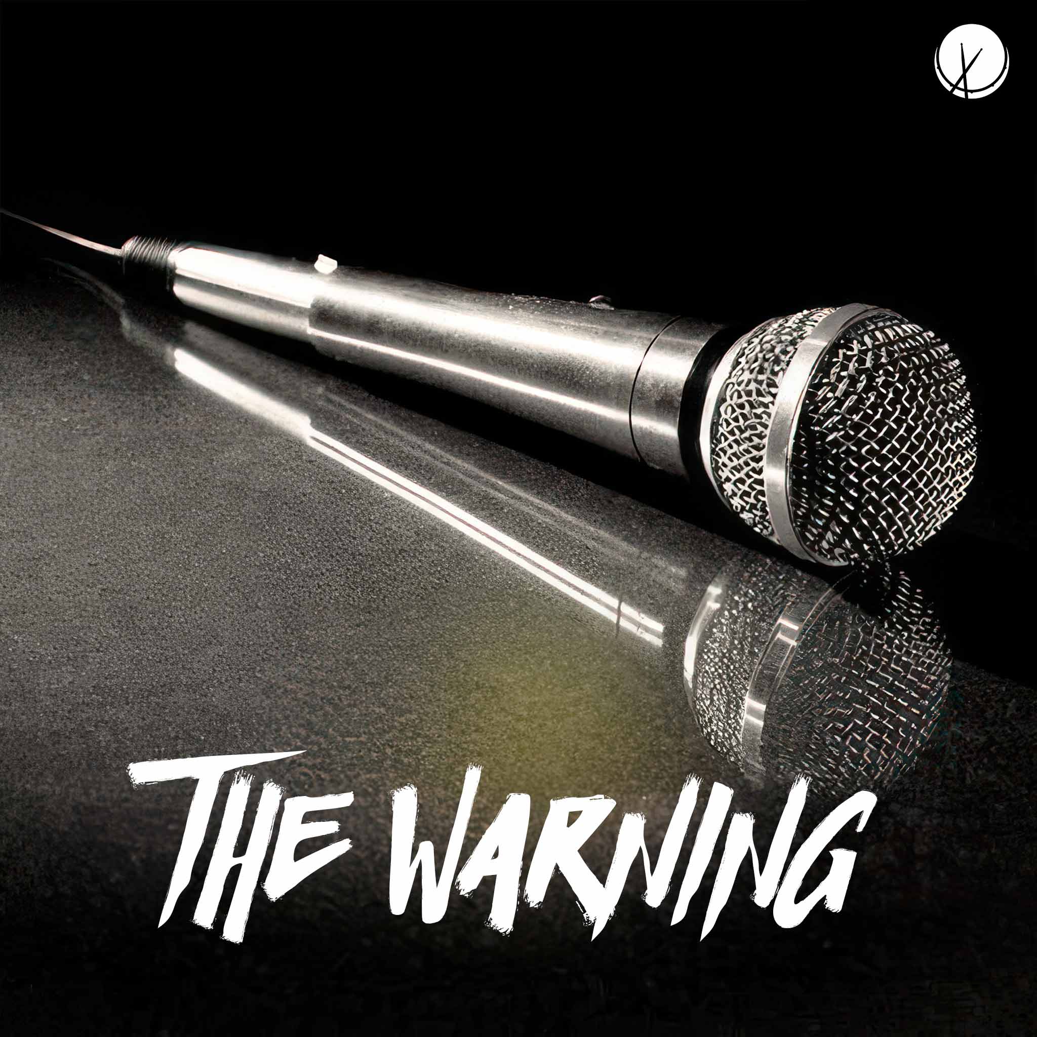 Microphone Laying Down on a Solid Black Background - The Warning