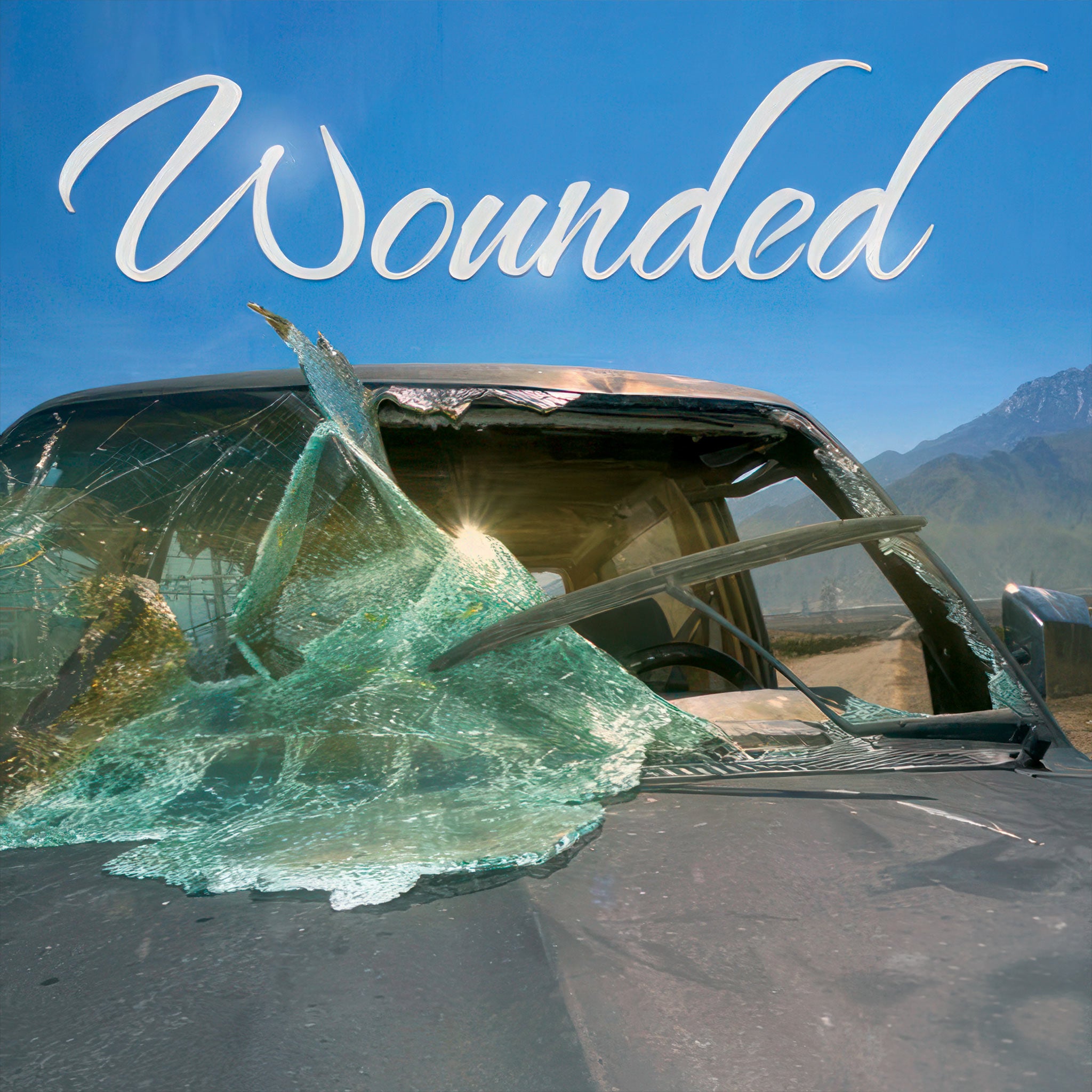 "Wounded" - Scene of a Car with Front Windshield Smashed, Broken Glass and Wiper, Daytime, Mountains in Background